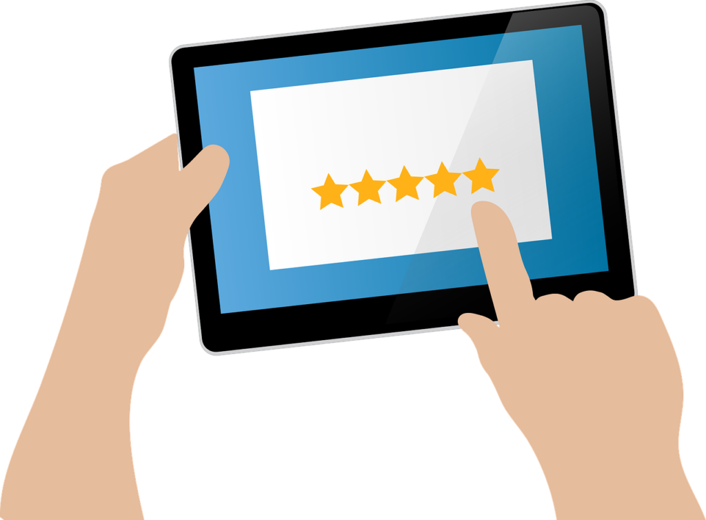 Hands holding a tablet with a 5 stars review vector