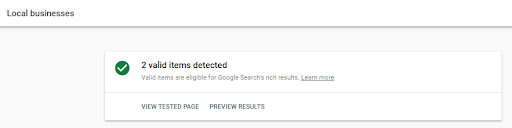 Screenshot of a Google schema testing tool showing a green checkmark and '2 valid items detected' for Local businesses.